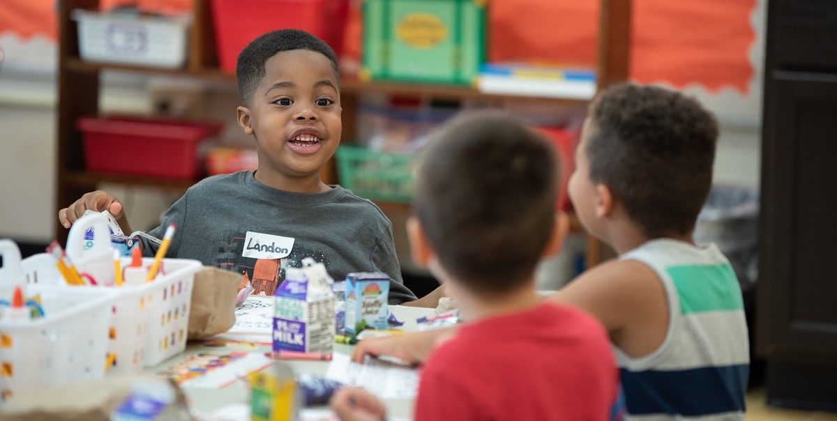 Kindergarten Students Smiling at Lunch