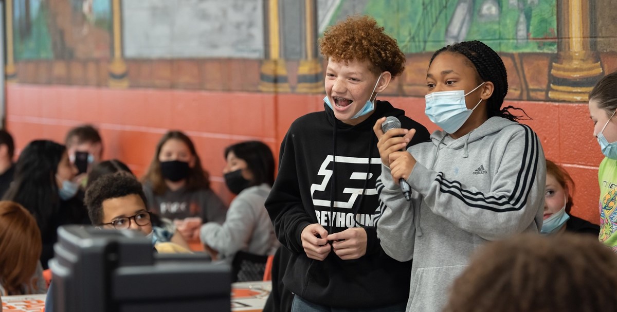 Middle School students singing karaoke