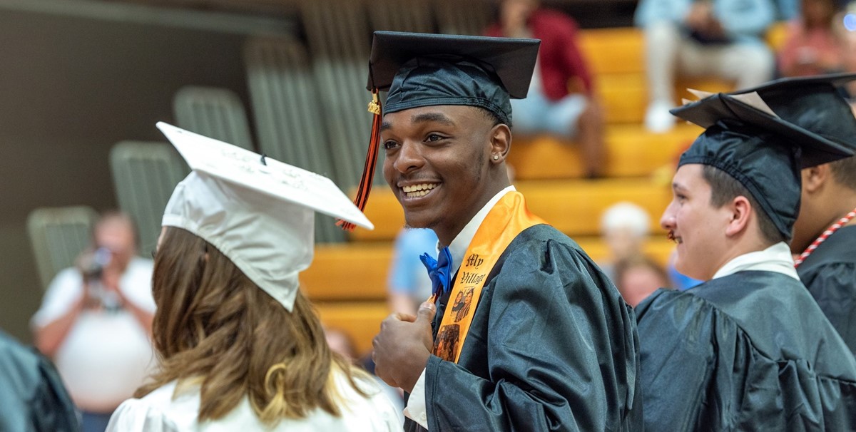 2022 Paris Graduate Smiling